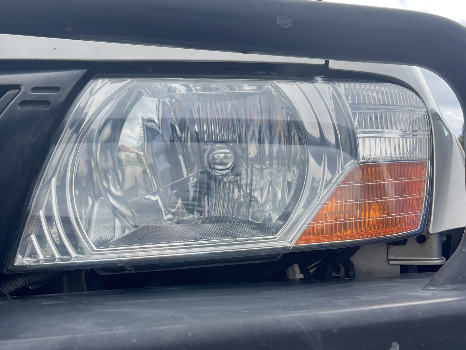 Mitsubishi Pajero headlight after restoration — clear and restored